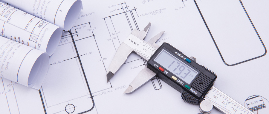 攝圖網_500511567_wx_工程圖紙與游標卡尺（非企業商用）.jpg